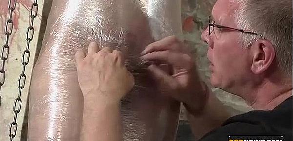  Shaved twink getting wrapped in plastic and wanked hard